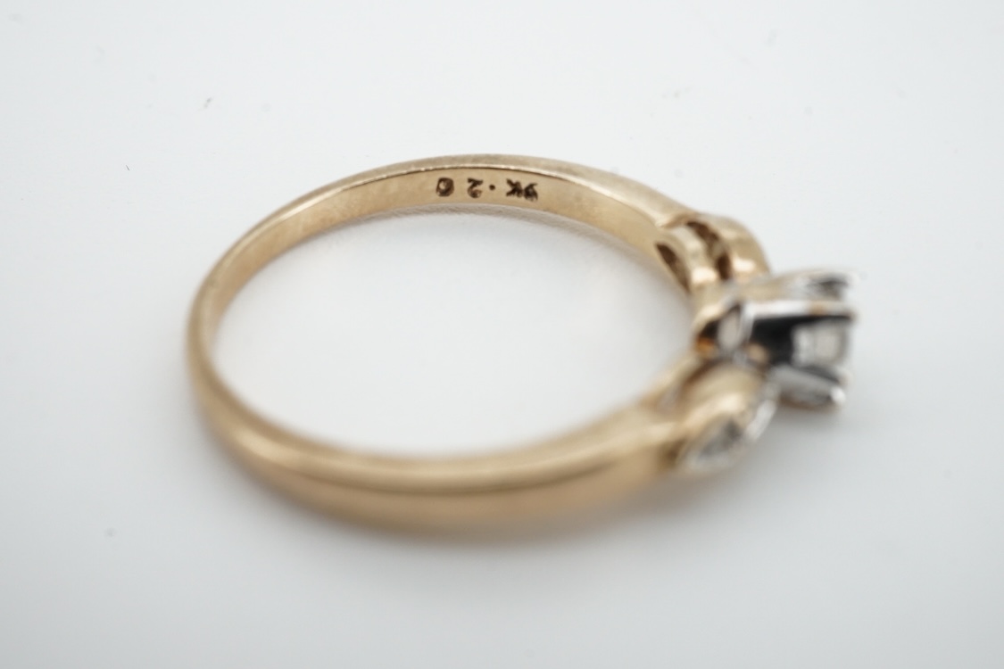 A modern 9ct gold and claw set single stone diamond ring, with four stone diamond chip set shoulders, size N, total carat weight approximately 0.20ct and a similar 9ct gold and six stone diamond set band, size K, gross w